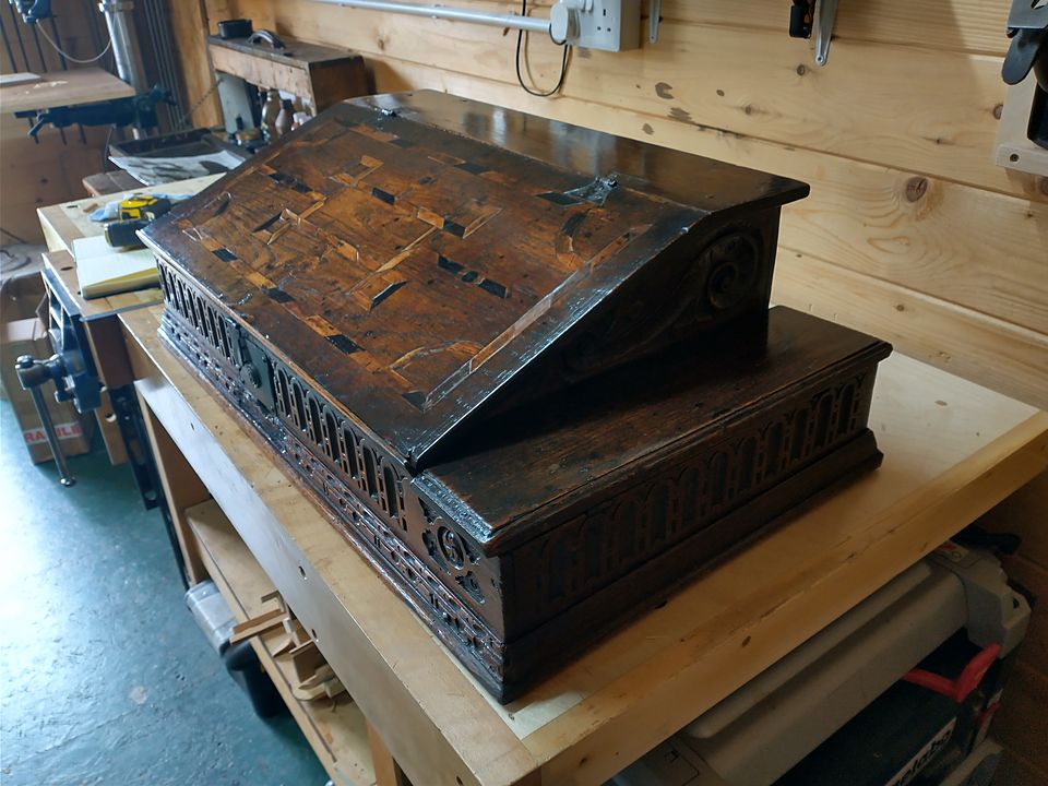 Antique carved desk box with an inlaid geometric lid and arcaded front, after restoration